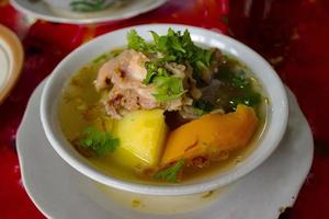 sop buntut or oxtail soup or tail soup is traditional soup made from tail ox, Boiled with Spices photo