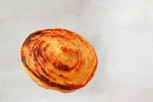 paratha bread or canai bread or roti maryam, favorite breakfast dish. on white background photo
