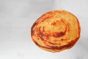 paratha bread or canai bread or roti maryam, favorite breakfast dish. on white background photo