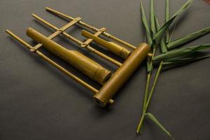 Angklung, the traditional sundanese musical instrument made from bamboo. Isolated on white background photo