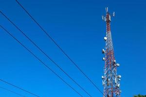 communication tower. Telco Trellis for 3G 4G 5G Apocalypse Internet Communication, mobile, FM Radio and Television Broadcasting On Air with Blue Sky in Background photo