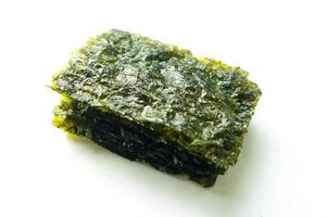 nori seaweed isolated on white background. Japanese food nori. Dry seaweed sheets. photo