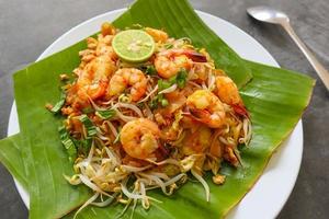Pad thai, or Phad thai, is a stir-fried rice noodle dish from Thailand. made from rice noodles, , bean sprouts, eggs, prawns and Thai spices photo