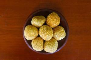 onde-onde or sesame ball or Jian Dui is fried Chinese pastry made from glutinous rice flour and coated with sesame seeds filled with bean paste. isolated on white background photo