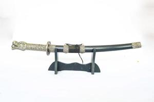 Japanese samurai short sword wakizashi , with dragon ornament, isolated on white background photo
