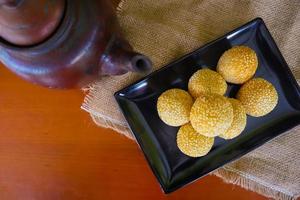 onde-onde or sesame ball or Jian Dui is fried Chinese pastry made from glutinous rice flour and coated with sesame seeds filled with bean paste. isolated on white background photo