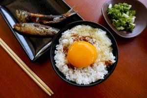 tamago kake gohan or raw egg on rice. traditional food from japan, eat on breakfast photo