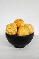 onde-onde or sesame ball or Jian Dui is fried Chinese pastry made from glutinous rice flour and coated with sesame seeds filled with bean paste. isolated on white background photo