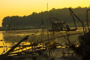 keramba ikan, fish farming in lake. keramba ikan is traditional fish cages, traditional aquaculture farm in indonesia photo