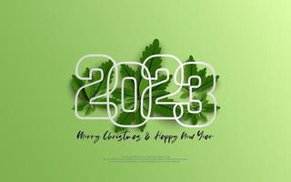 Happy New Year 2023 and merry christmas day. Design number outline on group of green leaves on green gradient background.