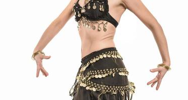 Beautiful belly dancer young woman in gorgeous red and black costume dress photo