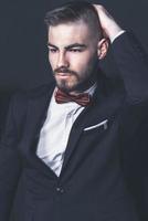 Elegant young handsome man. Studio fashion portrait. photo