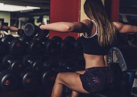 Woman doing a workout at the fitness gym. photo