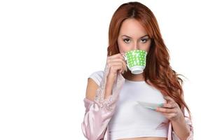 Beautiful woman drinking tea, drinking coffee, studio portrait photo