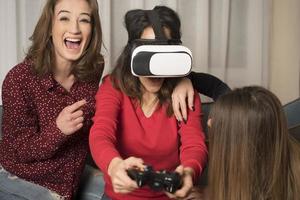 friends playing video games wearing virtual reality glasses photo