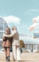 LGBT Lesbian couple love moments. Lesbian couple holding balloons in the park. Happiness concept photo