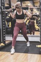 Woman doing a workout at the fitness gym. photo