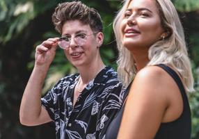 Same sex young married female couple in their daily routine showing some affection LGBT photo