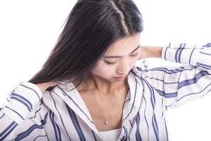 Young Asian woman playing with her hair photo