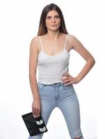 beautiful young woman with cinema clapper posing in studio. Movie concept. isolated photo