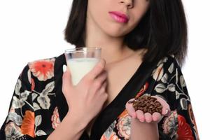 woman holding and drinking milk. photo