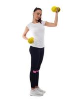 Determined woman losing weight and exercising with dumbbells photo