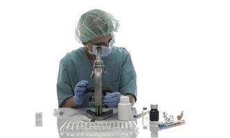 Scientist in blue medical gloves and uniform learning COVID-19 samples with microscope in laboratory. photo