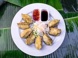 Vietnamese Food. Tasty Vietnamese food served on the top of a banana leaf. photo