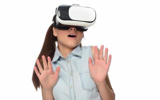 Young woman in virtual reality VR glasses. photo