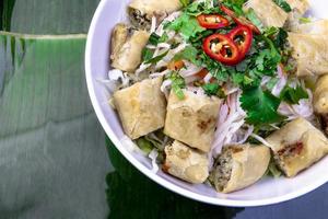 Vietnamese Food. Tasty Vietnamese food served on the top of a banana leaf. photo