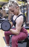 Woman doing a workout at the fitness gym. photo