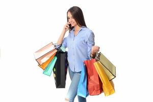 Beautiful smiling brunette with shopping bags. Shopping concept in studio photo