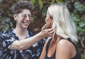 Same sex young married female couple in their daily routine showing some affection LGBT photo