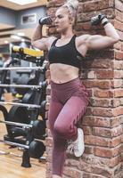 Woman doing a workout at the fitness gym. photo