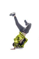 male model doing break dance routine. isolated on white background photo