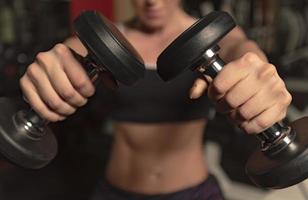 Woman doing a workout at the fitness gym. photo