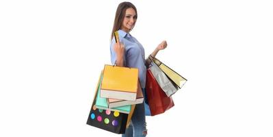 Beautiful smiling brunette with shopping bags photo