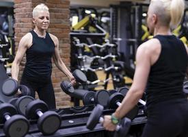 Woman doing a workout at the fitness gym. photo