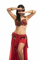 Beautiful belly dancer young woman in gorgeous red and black costume dress photo