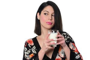 woman holding and drinking milk. photo