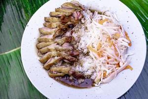 Vietnamese Food. Tasty Vietnamese food served on the top of a banana leaf. photo