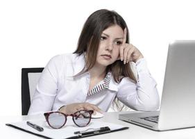 beautiful female model working on a laptop photo