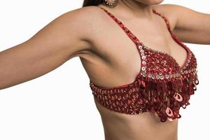 Beautiful belly dancer young woman in gorgeous red and black costume dress photo