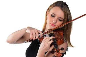 Beautiful natural blond girl holding and playing violin. photo