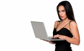 beautiful smiling woman holding laptop computer photo