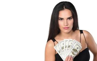 Portrait of young beautiful woman holding American dollars photo