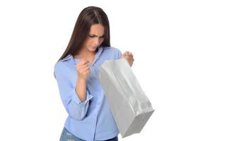 Shopping concept. Beautiful smiling brunette with shopping bags posing on white background photo