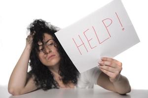 woman holding HELP sign. photo