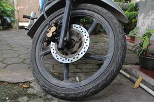 Front wheels of motorcycles exposed photo