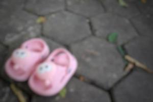 Defocused or unfocused or blur pink sandals for babies photo